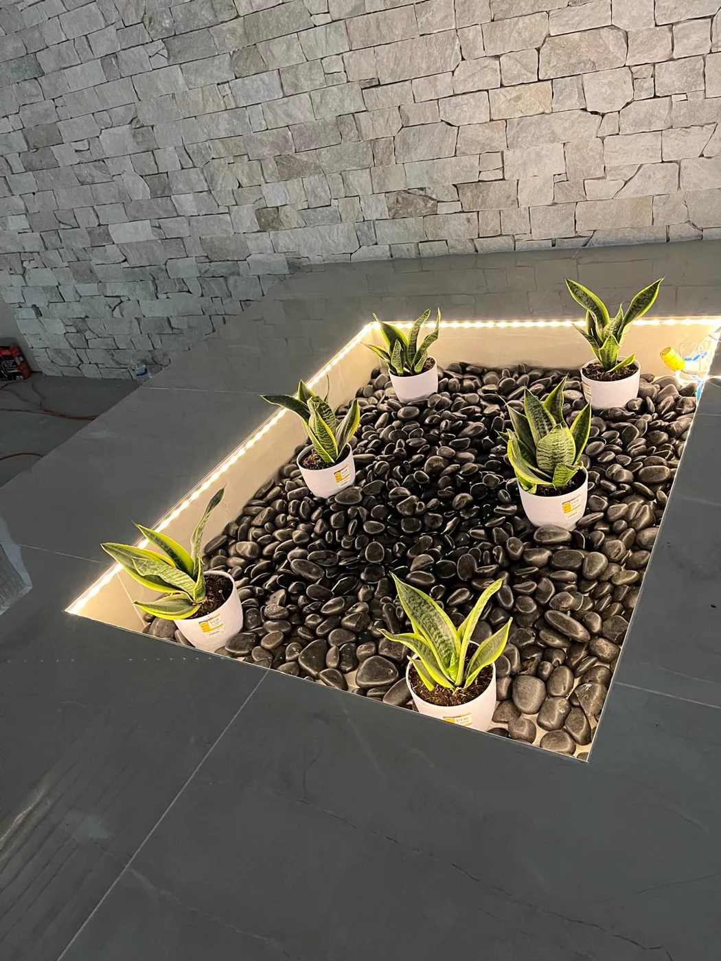 Interior stone planter with live plants, finished commercial venue renovation, Metro Atlanta