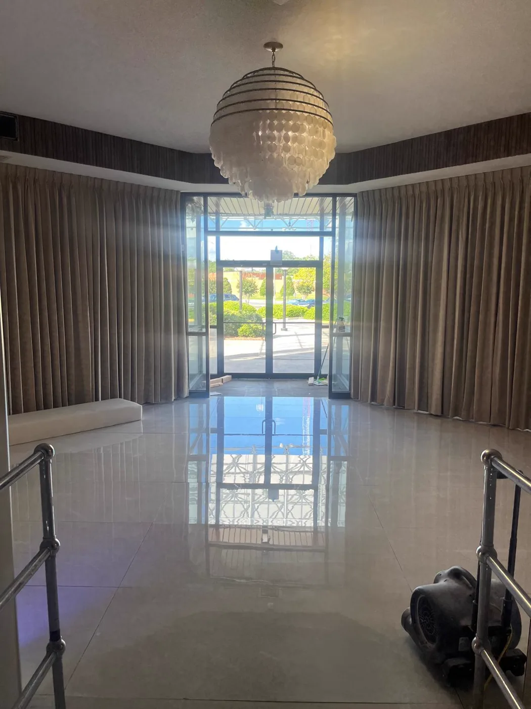Grand lobby with a chandelier and polished marble flooring, commercial venue renovation, Metro Atlanta