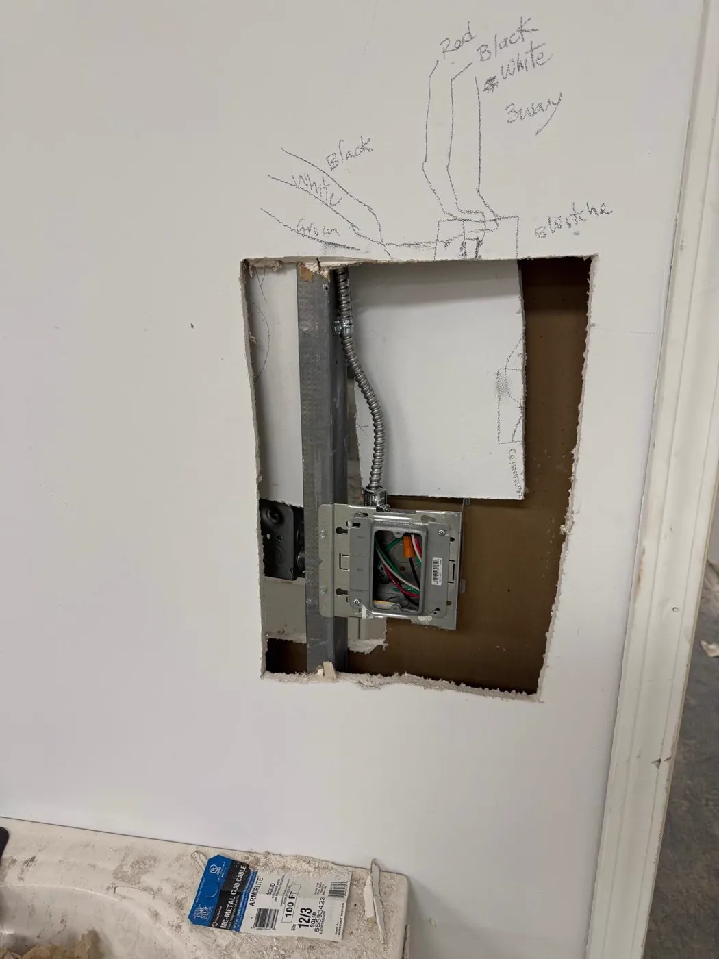Sub-panel set into a wall opening during an electrical upgrade, Metro Atlanta